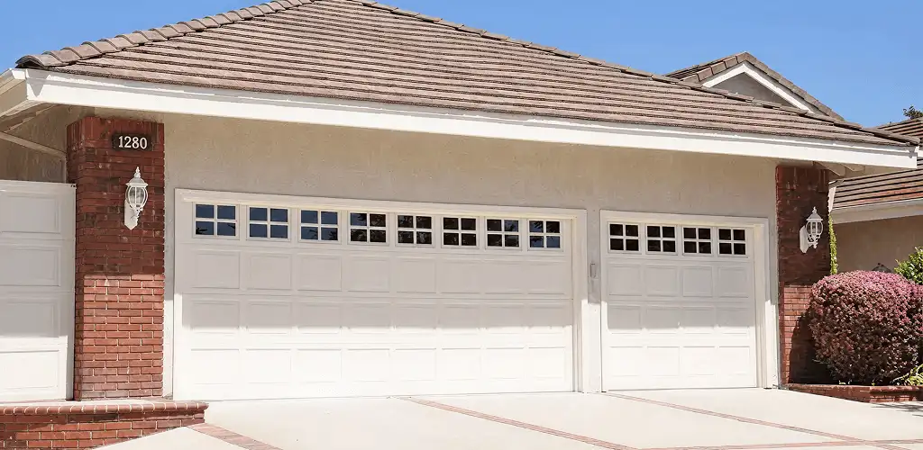 Residential garage door repair service for a double garage door in Huntsville, AL