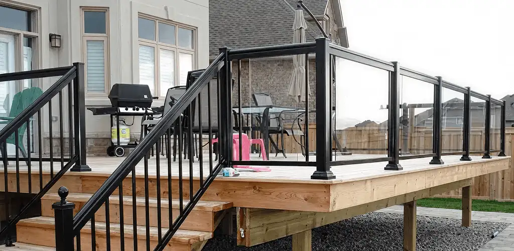 Handrail installation on a deck staircase for safety and code compliance in Huntsville, AL