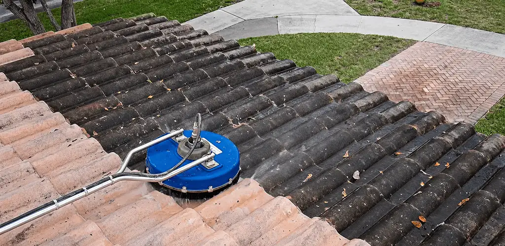 Roof pressure cleaning removing debris and buildup from roof tiles in Huntsville, AL